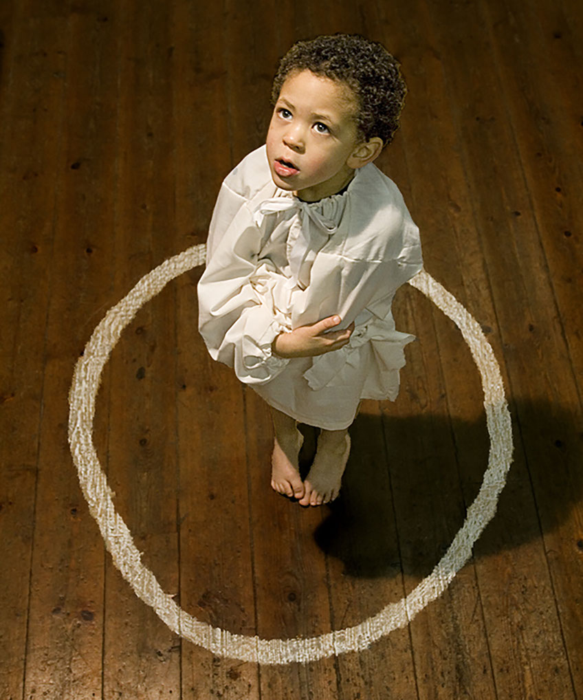Boy in a Chalk Circle - a photograph taken to promote a play at the Wyeside Arts Centre in Builth Wells